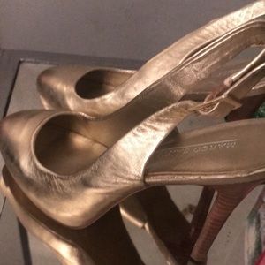 Gold heels leather upper. Brand new never worn